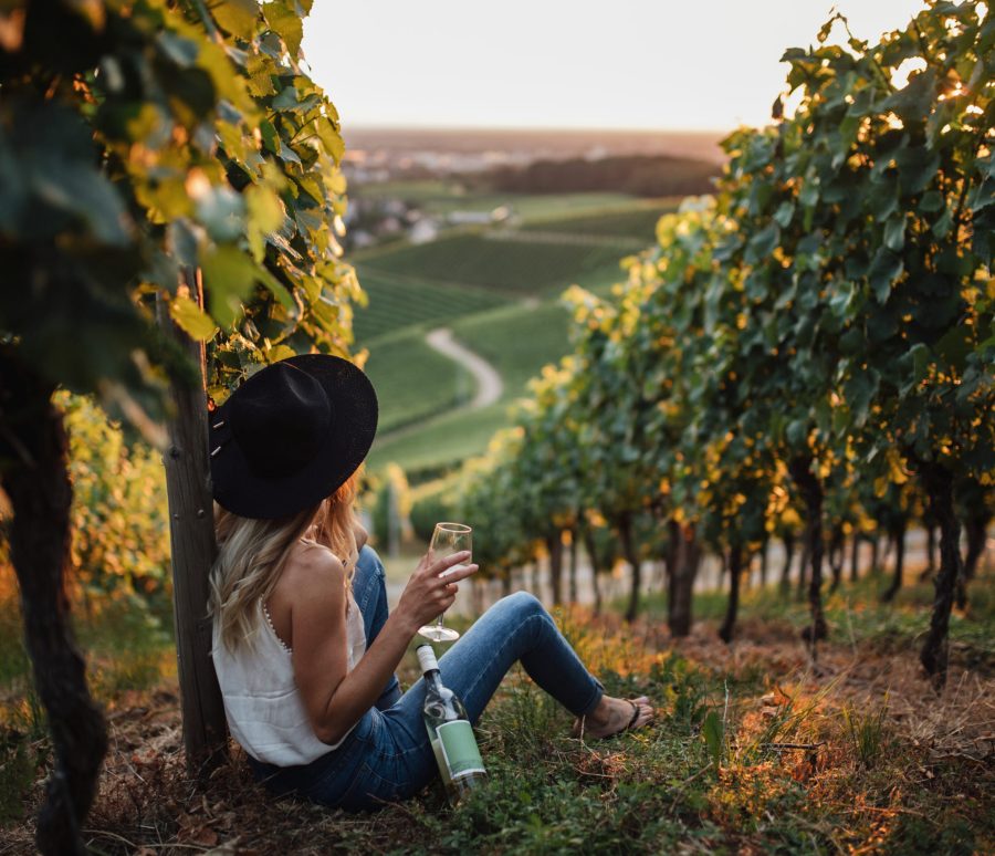 young-blonde-woman-relaxing-vineyards-summer-season-with-bottle-wine young-blonde-woman-relaxing-vineyards-summer-season-with-bottle-wine